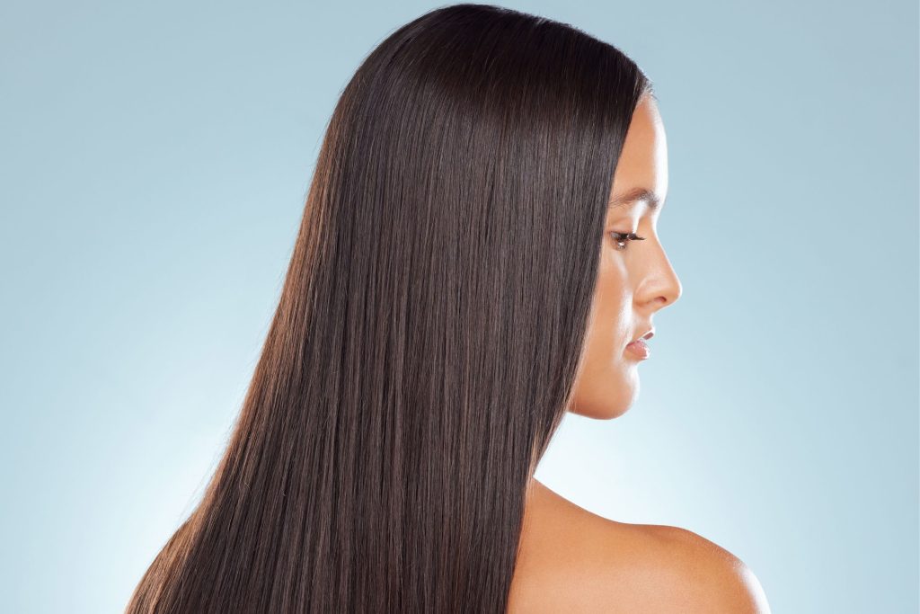 a young woman after hair straightening treatment a young woman after hair straightening treatment