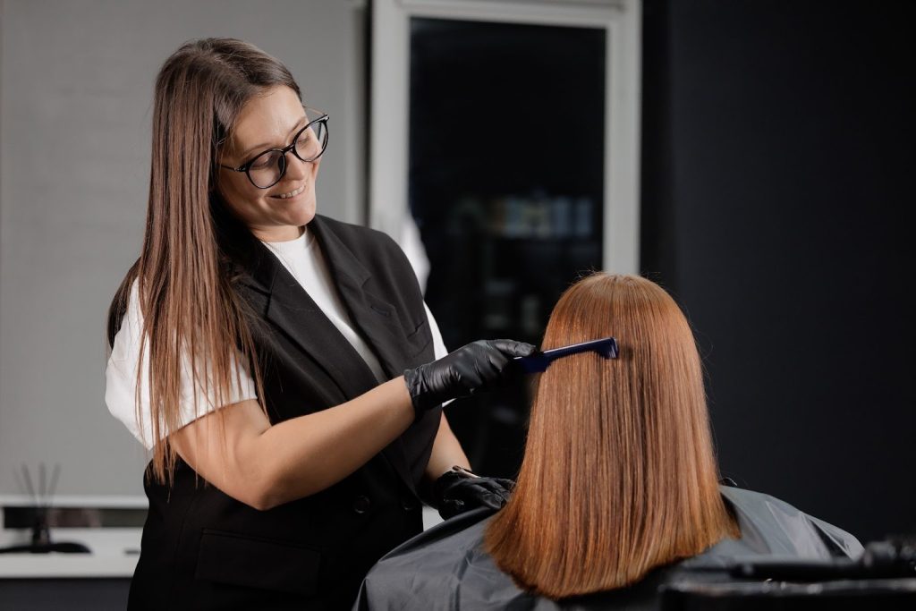 chemical hair straightening in progress