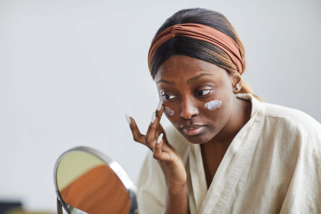 young black woman doing skin care product test